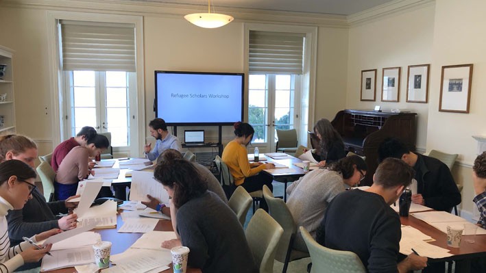 Students pore over archived documents as part of the Refugee Scholars Workshop hosted by the Rockefeller Archive Center
