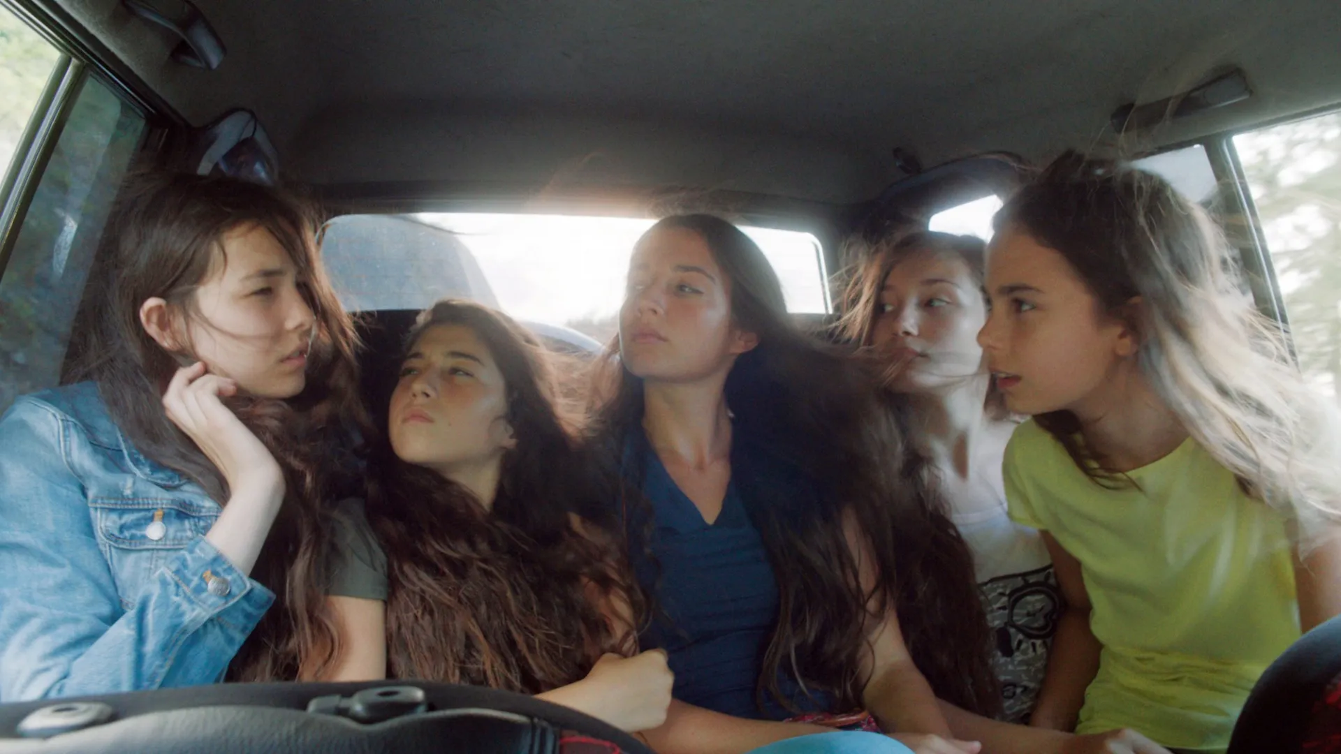 Screenshot of the film Mustang, with five young girls in the car