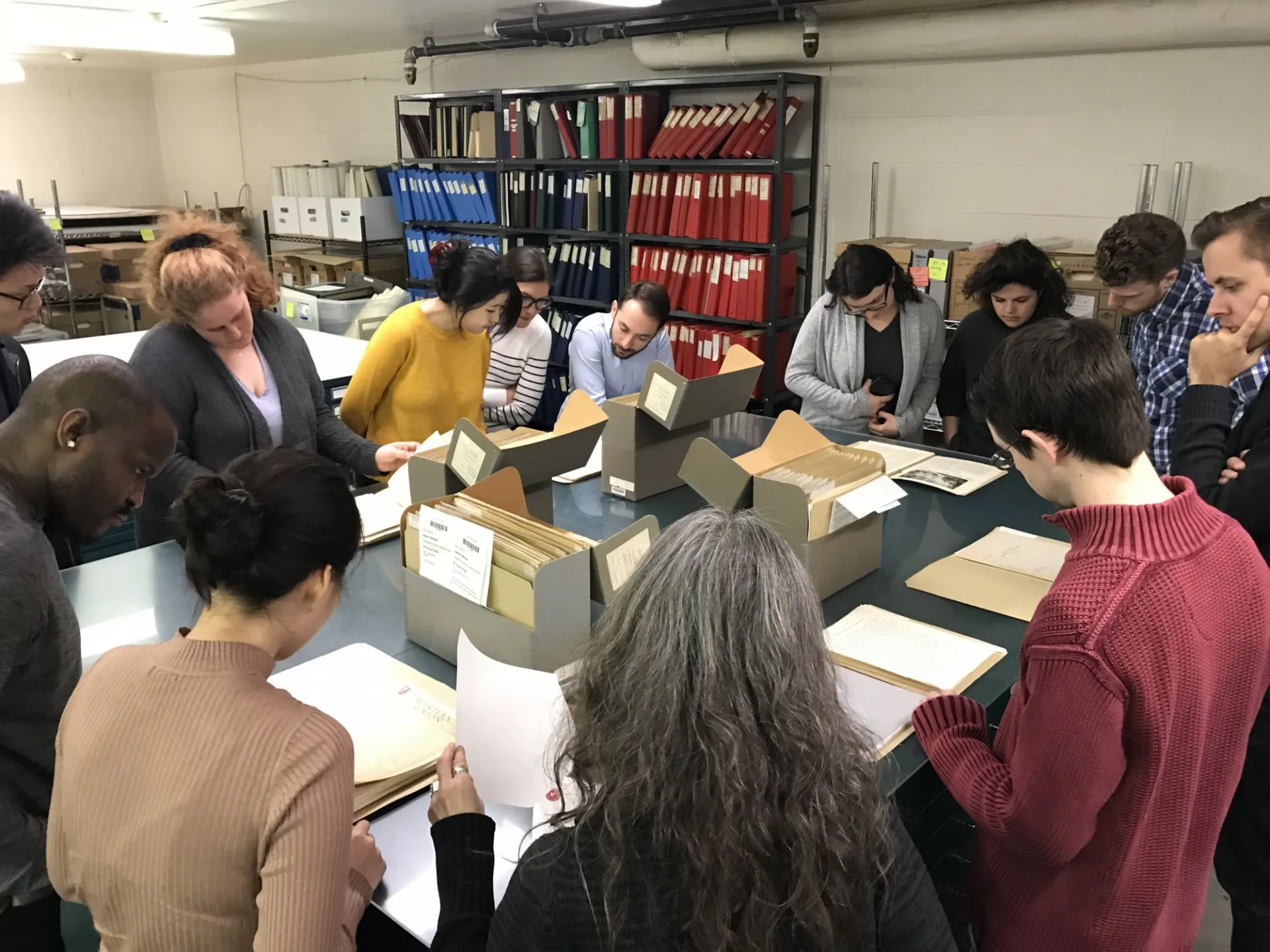 Students pore over archived documents as part of the Refugee Scholars Workshop hosted by the Rockefeller Archive Center