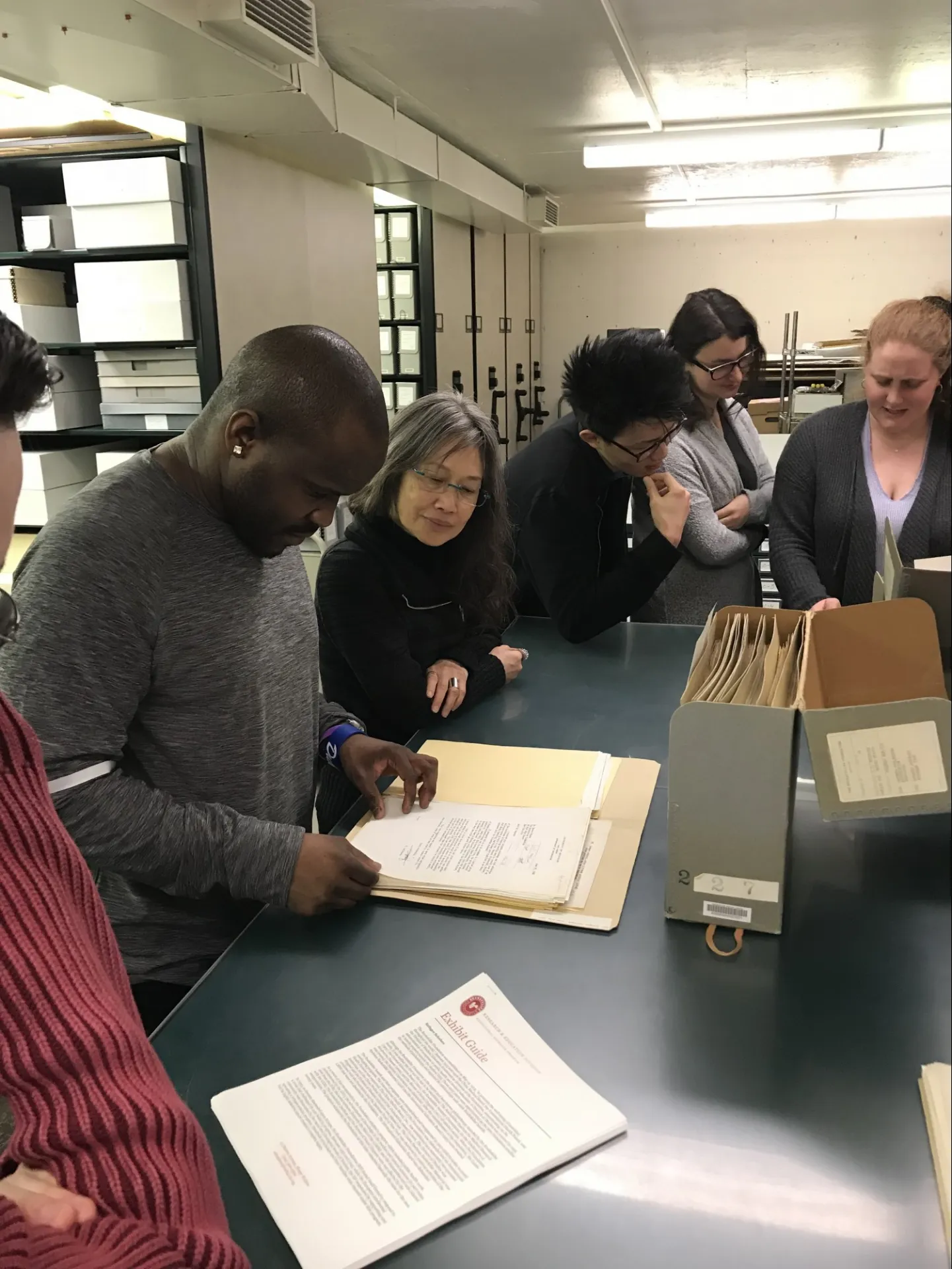 Students pore over archived documents as part of the Refugee Scholars Workshop hosted by the Rockefeller Archive Center